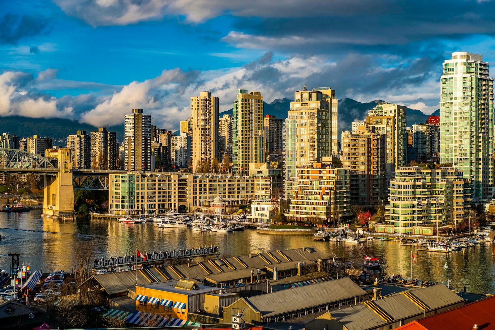 Vancouver waterfront skyline with residential towers and mountains